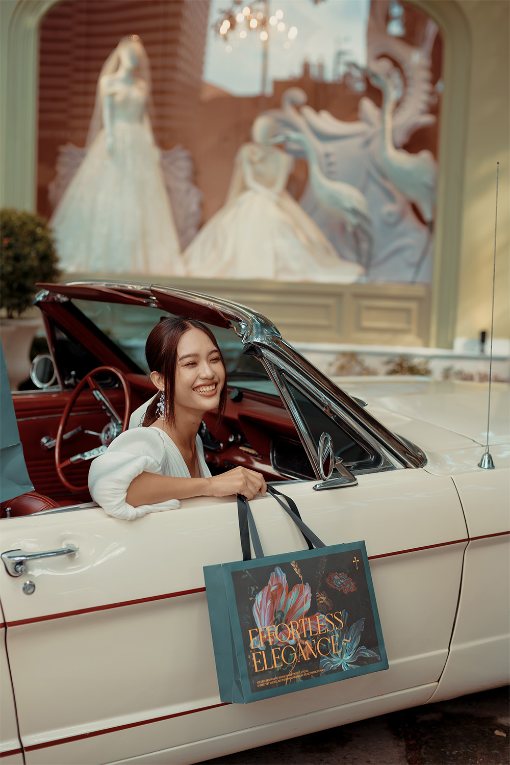 bride smiling and holding Brides's bag